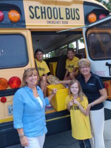 Rotary Club of Frederick helping United Way stuff the bus